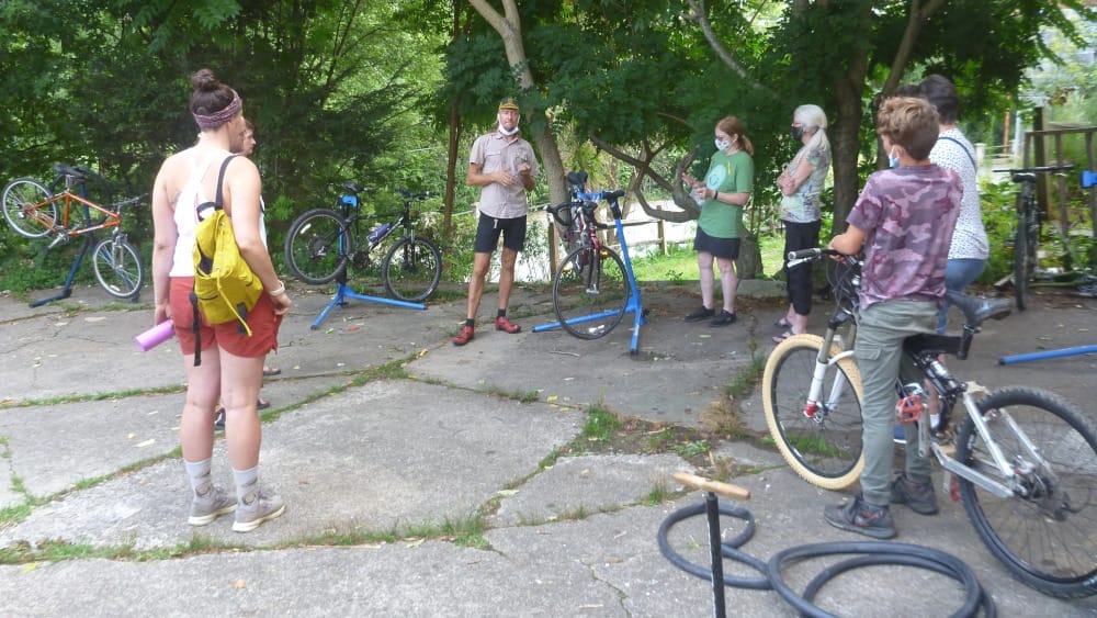 Bike Clinic: Basic Maintenance w/ Matty Semkowich 3 people learning how to fix their bike