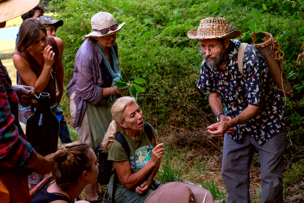Naturalist Doug Elliott sharing stories in the forest