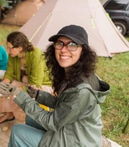 Miranda Crawley sits in an earthskills workshop at Firefly Gathering