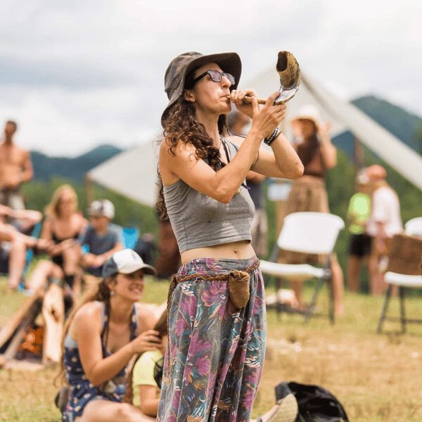 Kelsey Leahy blows a shafar to signal the class change at Firefly Gathering